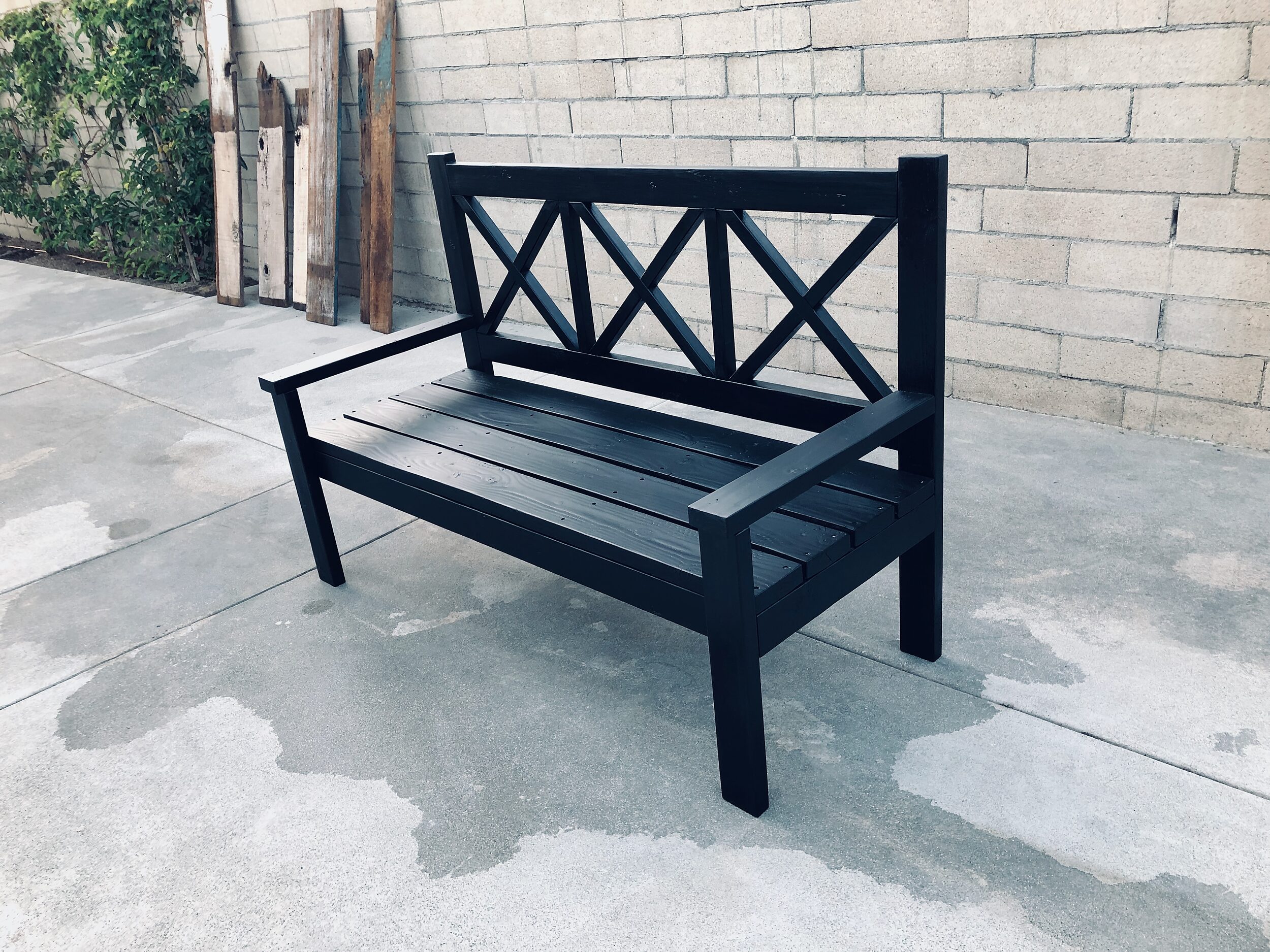 Black Farmhouse Porch Bench with a Triple X-Back Design